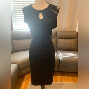 Black midi dress with sheer detail on top and waist areas. See pictures.